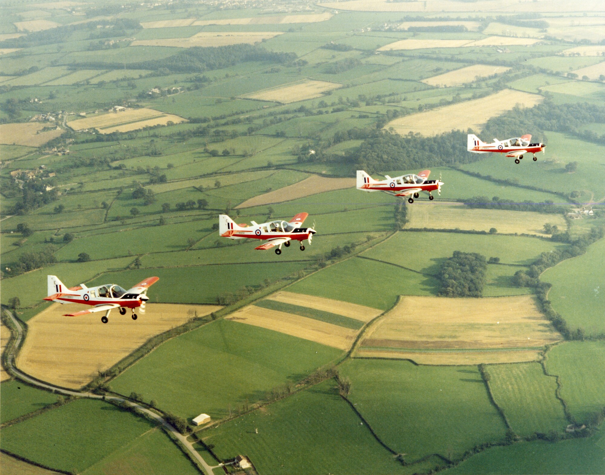 Four RAF Scottish Aviation Bulldog 120s flying in formation.