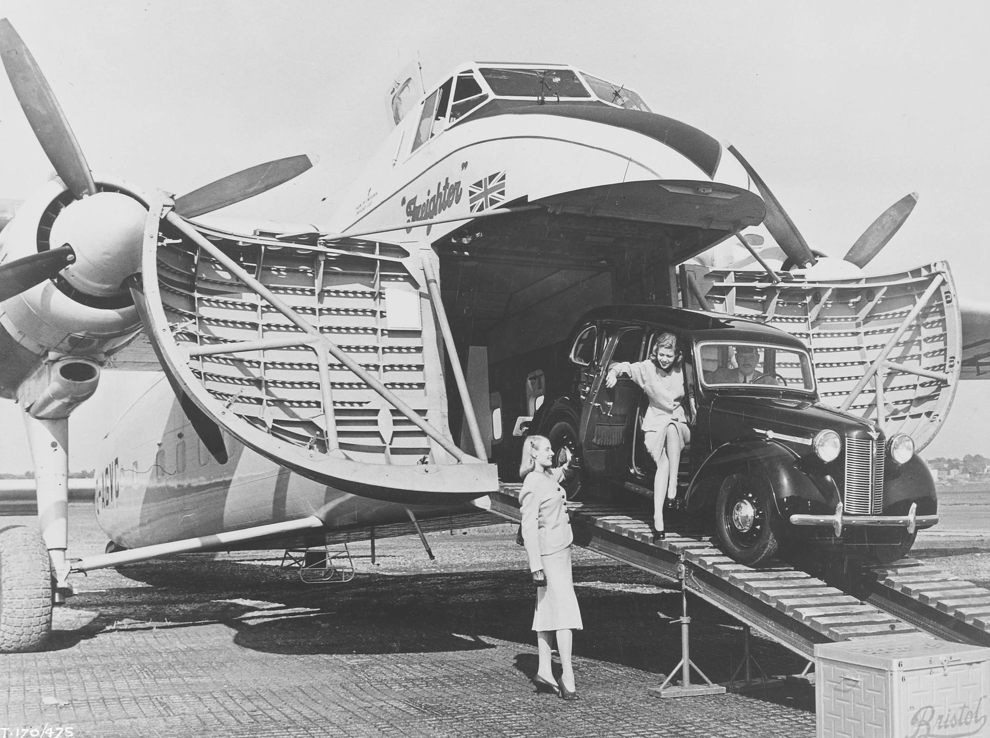 Bristol 170 Freighter ground view of car unloading through open cargo doors.