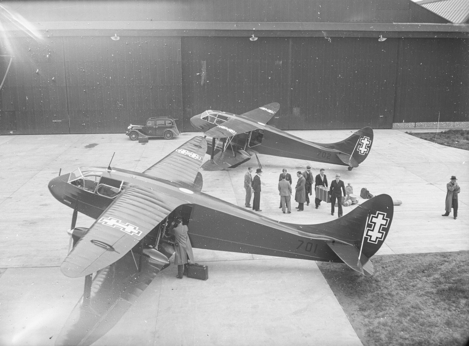 Two Lithuanian de Havilland DH.89M Dragon Rapide aircraft at Hatfield, people loading aircraft, 14th May 1937.