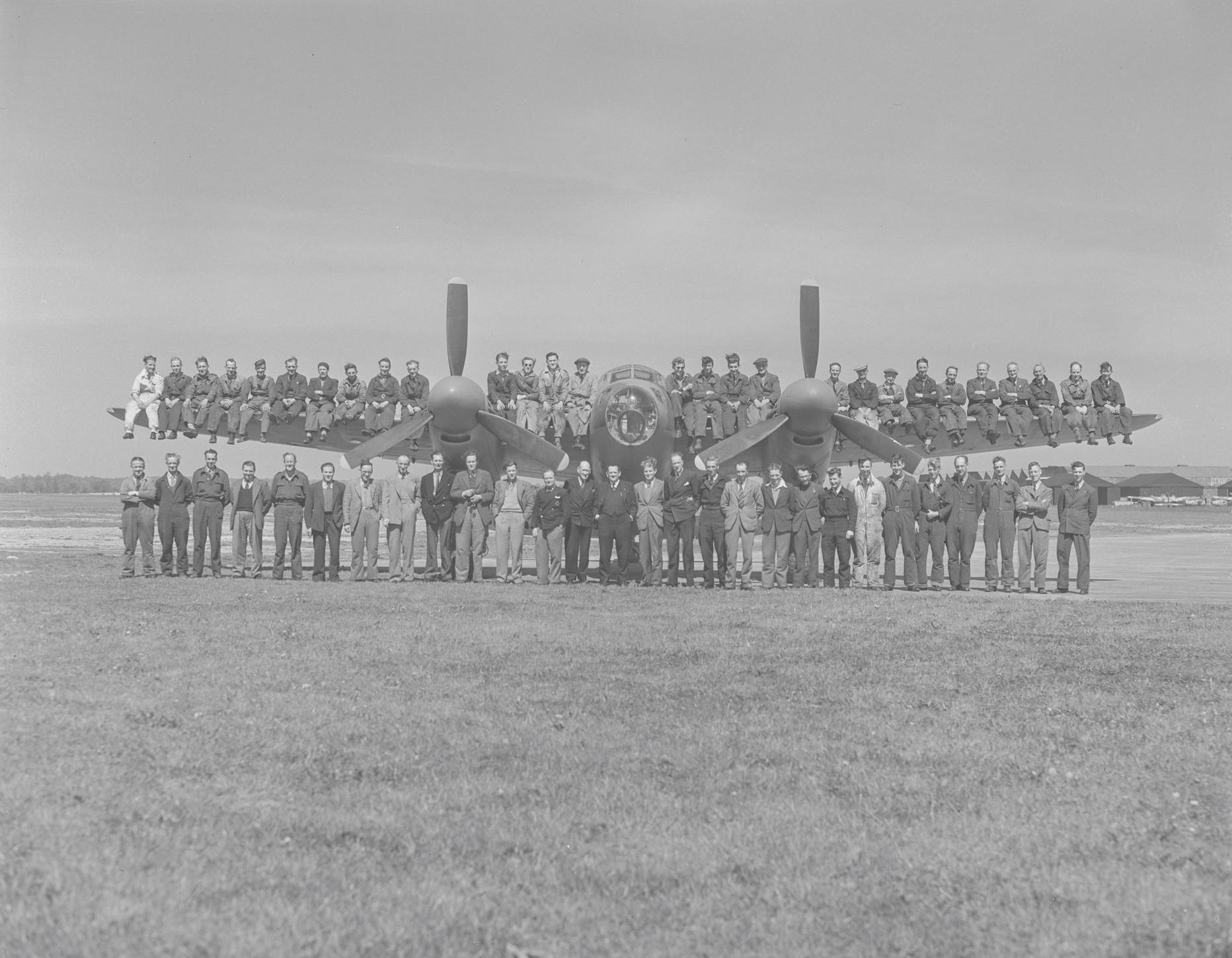 de Havilland Aircraft flight test and support personnel posing with a Mosquito aircraft at Hatfield, 10th May 1946.