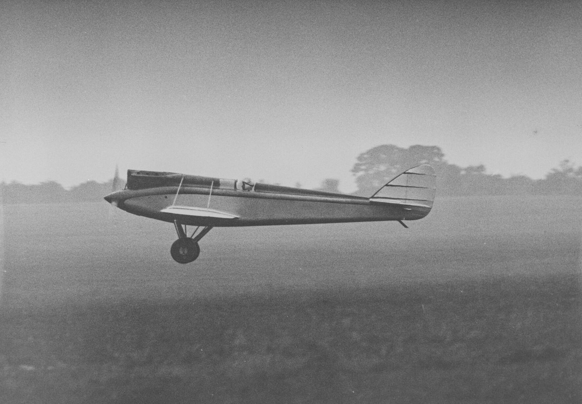 de Havilland DH.71 Tiger Moth G-EBQU in level flight showing its clean lines.